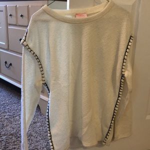 Off white sweater with black stitching